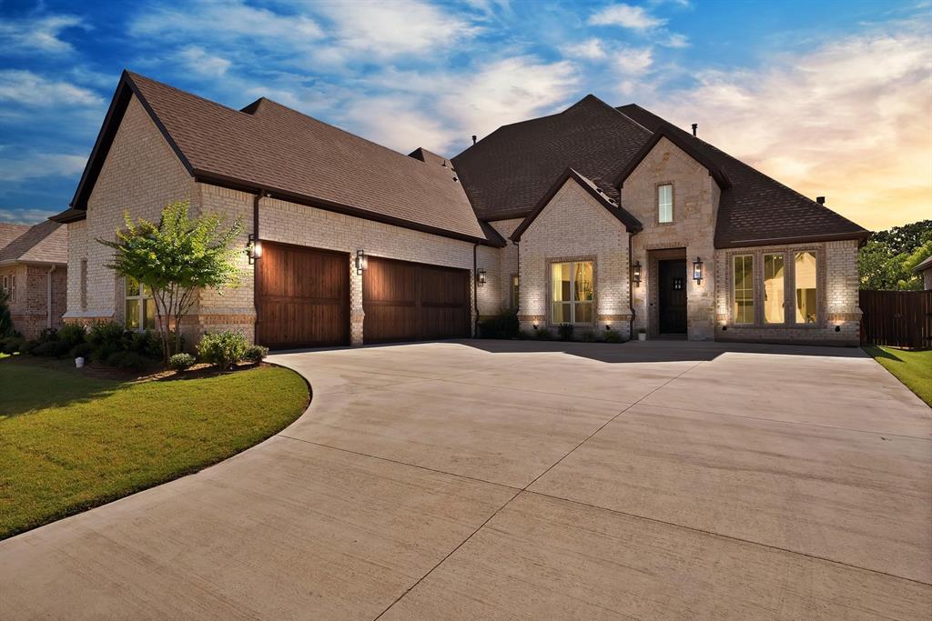 Search Evan Downey Real Estate Youtube Shorts channel for video walkthrough. Welcome to this exquisite custom home by Boyd Builders, Inc in the luxury gated community of Harris Place with a spacious greenbelt. This meticulously designed residence offers a perfect blend of elegance, comfort, and functionality, making it the ideal place for your family to call home. The spacious living room is the heart of the home, featuring a beautiful fireplace with gas logs. The gourmet kitchen is a chef's dream, complete with a massive island with seating, a gas cooktop, double ovens, quartz countertops, and custom cabinetry. The luxurious primary suite is a true retreat, offering a soaking tub, separate vanities, and a generous walk-in closet. One of the guest bedrooms comes with its own ensuite, providing privacy and comfort for visitors. This home also includes a dedicated study, formal dining area, and a game room, ensuring ample space for all of your needs, whether you're working from home, hosting formal gatherings, or enjoying family time. Handscraped hardwood floors are anothergorgeous feature throughout the home. Cedar garage doors add a classic touch to the exterior. Step outside and enjoy the oversized covered patio with a fan, perfect for relaxing or entertaining. With a peaceful greenbelt directly behind the home, you’ll have added privacy, enhancing the outdoor living experience. Located in the highly sought-after Mansfield ISD, this home is perfectly situated near shopping, dining, and parks, offering convenience and accessibility to everything you need. Don't miss out on the opportunity to own this stunning home.