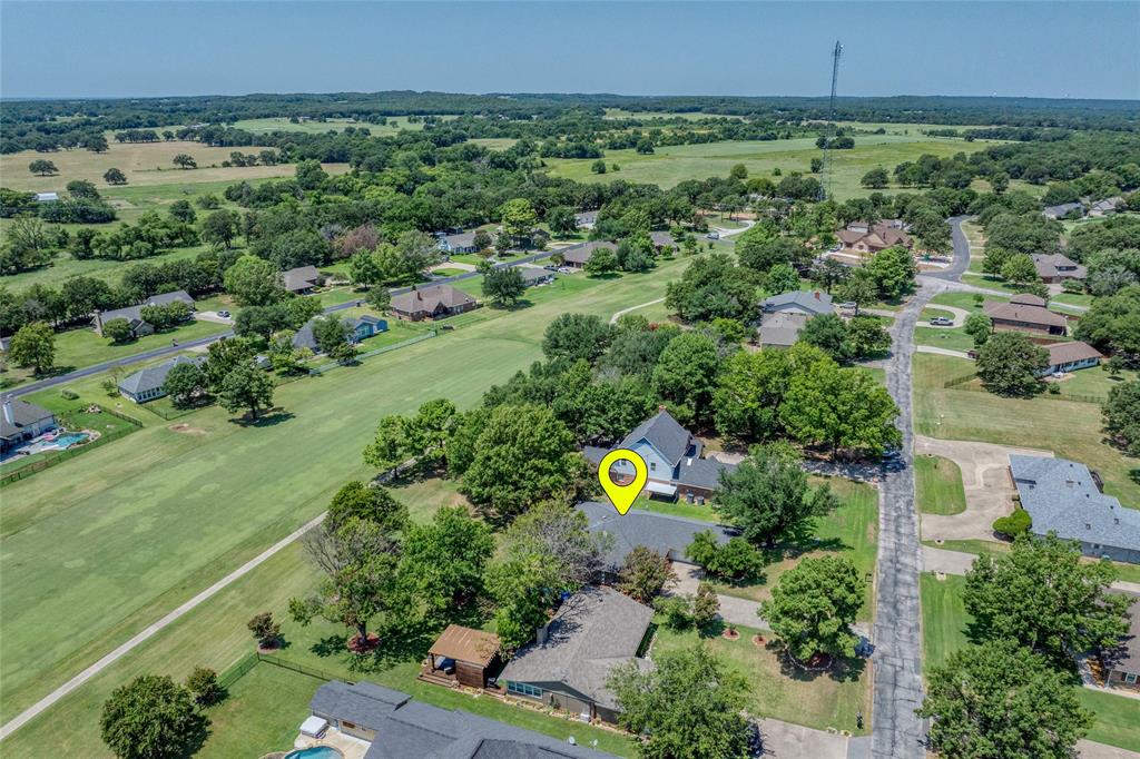 Tucked along a quiet interior road, this thoughtfully designed home on Lake Kiowa’s championship golf course is ready for your personal touch. Unwind on the covered patio or spacious deck, where you’ll enjoy serene, park-like views and a front-row seat to golfers lining up their approach shots on the 11th fairway. Inside, the home offers three generously sized bedrooms and three full bathrooms. The kitchen is well-equipped with black appliances—including a dishwasher, disposal, microwave, and electric oven—along with ample counter space and abundant cabinetry. An electric cooktop sits in the eat-at peninsula, perfect for casual meals or entertaining. Just off the kitchen, a full-size laundry room includes a pantry and built-ins for extra storage. The open-concept layout keeps everyone connected, whether you’re preparing meals or hosting guests. A cozy wood-burning fireplace anchors the living room, making it an inviting spot to gather on cooler days. Large windows fill the space with natural light and showcase beautiful views of the backyard and fairway beyond. The spacious primary suite features a private ensuite bath and an additional closet. Secondary bedrooms are thoughtfully positioned on the opposite side of the home for added privacy, each with easy access to its own full bathroom and generous closet space. Conveniently located near the Lake Kiowa Clubhouse and Golf Pro Shop, this home offers access to a wide range of amenities. Residents enjoy complimentary golf, with affordable guest fees. Beyond golf, you can relax at East Beach, dine at the clubhouse, or take advantage of tennis and pickleball courts. Multiple community docks make it easy to launch a boat for fishing or water sports—without the hassle of public lake crowds, as Lake Kiowa is exclusive to residents. Move-in ready with plenty of potential to make it your own, this is an opportunity you don’t want to miss. Schedule your showing today. Be sure to check out the video under virtual tours.