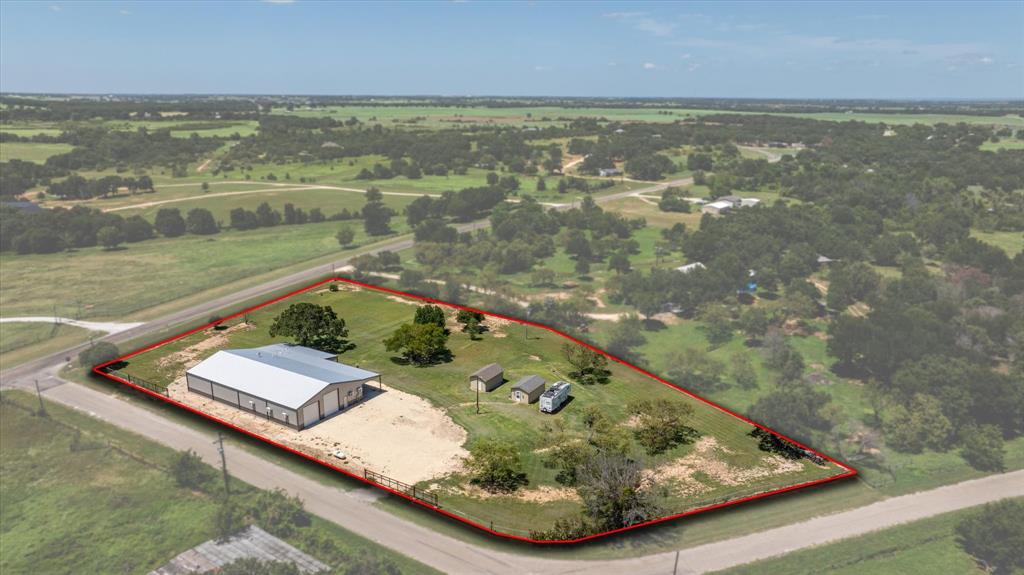 LIVE-WORK BARNDOMINIUM ON 2.29 FENCED ACRES IN TOLAR. This is not a typical country property. Built in 2022, this fully insulated live-work setup offers over 1,800 sq ft of well-designed living space plus a substantial climate-controlled shop and oversized garage space built for serious use. The garage will accommodate a Class A motorcoach with room to spare, and the fenced corner site with dual gated access adds flexibility for vehicles, trailers, hobbies, storage, or home-based operations. Whether you need space for an RV, collector vehicles, equipment, workshop use, or simply want a rare property that combines living and utility in one place, this one stands apart. Located on 2.29 acres at Hwy 51 and Prairie Creek Lane, the property also offers the infrastructure and functionality that would be difficult to replicate at this price point. Rare opportunity for the buyer who values flexibility, security, and usable space over a conventional floorplan. BRING ALL OFFERS.
