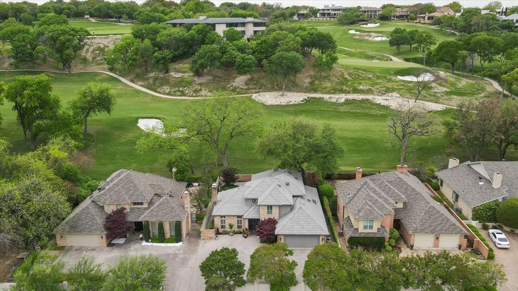 Imagine the rare opportunity for the 6th hole at Shady Oaks to be in your backyard. Meticulously maintained, thoughtful updates are abundant in this gorgeous home. Large open living and dining areas with tall ceilings overlook a large patio areas with spectacular golf course view. The kitchen features stainless steel appliances, granite countertops, tile backsplash and double ovens. It opens to the den and breakfast bar with built in wine cooler, perfect for entertaining. Primary suite is on the first floor with stunning bathroom including dual vanities, soaking tub and large separate shower. Custom closets throughout. There are two bedroom upstairs each with their own bathroom. Property has a security gate. Dreamy lock and leave golf course living!