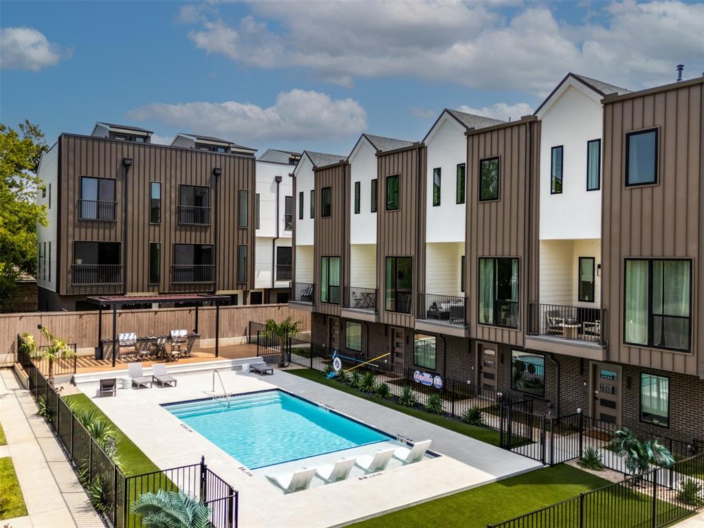 One of Dallas's most compelling new urban addresses — A 1% preferred lender closing cost credit is available — reducing your out-of-pocket at closing by approximately $5,795. Midtown Heights delivers a resort-style community pool, landscaped BBQ areas, and an intimate neighborhood feel, all within a mile of Uptown, the Katy Trail, Henderson Ave, and Deep Ellum.
Unit 101 is the front-facing cornerstone of this community — and it shows. Step through your private entrance, framed by a fenced front yard with mature landscaping, into a home that was built in 2025 and feels it. Real hardwood flooring runs wall-to-wall. Ceilings soar. Tall doors give every room a quiet sense of architecture.
The first floor opens into an expansive flex room — configured as a home office today, but equally suited as a third bedroom, studio, or gym. The main level's open-concept kitchen is anchored by high-end appliances and flows directly to the living area and a private balcony with peaceful views of the yard below. Look up on a clear day and the Dallas skyline frames the horizon.
The primary suite occupies its own floor — a spacious bathroom, walk-in closet, and a bonus niche that adapts to your lifestyle. A second bedroom and full bath complete the upper level. The 2-car garage includes built-in EV charging, ready for the car you have or the one you're about to buy.
Community amenities — resort pool, BBQ areas, professional landscaping — are covered by the HOA, so your weekends stay your own.
