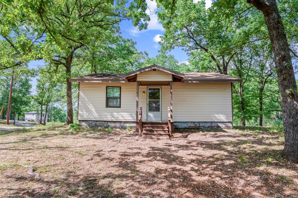 Move in ready or light fixer upper, this cute home is located in the Oak Acres subdivision of Cedar Creek Lake. The property is a very short walk from the wide open water and offers a serene and relaxing surrounding. Sitting on a large corner lot, the house has 3 bedrooms and 2 full bathrooms and lots of living space. The kitchen and living room are an open concept design with a large utility room-bathroom. If you are a weekender or full time, Oak Acres gives you an HOA community that features a boat launch and a very peaceful living environment. Whether you enjoy boating, fishing, walking or just taking it easy, this is the place to be!
