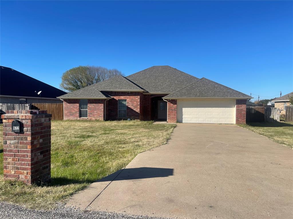 Spacious 4-bed, 2-bath home in Granbury with an open floorplan. The main living area is roomy, and there's a second area with a charming fireplace that can double as a formal dining space. Large rooms with high ceilings and plenty of natural light.  The well-equipped kitchen has ample cabinet and counter space, along with built-in appliances. The primary suite has a thoughtful layout with dual sinks, a garden tub, separate shower, and a walk-in closet. The fenced backyard has open and covered patio areas for outdoor activities. Additional features include a full-size utility area, alarm system, and storage shed. Call for a tour today!