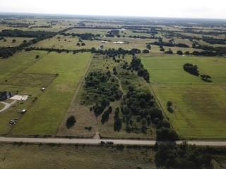 Directly across the road from over 235 acres of LBJ National Grasslands, Just 10 min to Alvord and only 20 min to Decatur, this rural property is out of town, but not too far out of town! 14 acres to do with as you please, bring your animals or if you don't have any... get some! Overhead electric is at the front of the property, fully fenced, and scattered with a variety of mature hard and soft woods. Great soil and native grass, and blackberry vines galore! Contact list agent to see this charming piece of Texas countryside for yourself