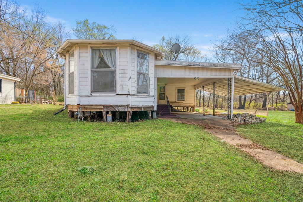 If you’ve been searching for a home with heart, history, and endless potential, this West Paris charmer is ready for its next chapter.  Full of personality and brimming with opportunity, this property offers a flexible layout, beautiful hardwood floors just waiting to be restored to their former glory, ample covered parking, and a spacious lot shaded by mature trees. Bring your creativity and turn this diamond in the rough into something unforgettable.  Situated just south of Clarksville St., it's nearby plenty of shopping options and is just minutes from historic downtown Paris with dining, entertainment, and local culture. Enjoy a location that keeps everything within easy reach. This home is positioned near fitness facilities, grocery shopping, dining, and healthcare services, offering both convenience and comfort in your day-to-day routine.