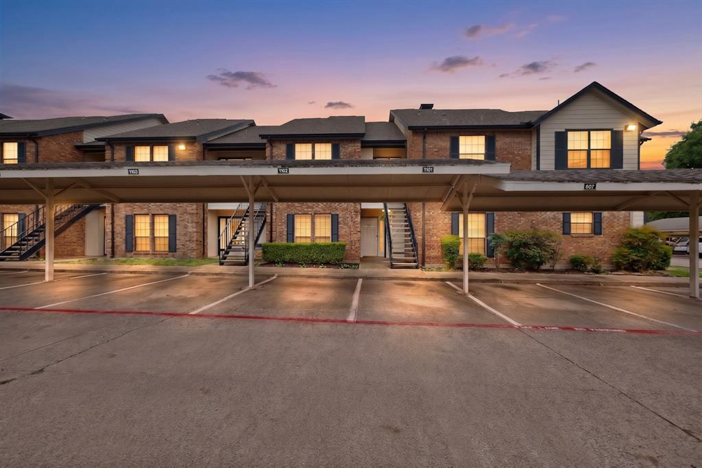Beautifully updated first-floor condo offering comfort, style, and convenience in a desirable Carrollton location. This move-in-ready one-bedroom, one-bath home features an open floor plan with wood-look flooring, crown molding, neutral designer colors, and a cozy brick fireplace. The updated kitchen boasts granite countertops, stainless steel appliances, abundant cabinetry, and a breakfast bar that opens to the spacious living and dining areas. The oversized bedroom offers generous closet space and easy access to the updated bath. Enjoy the convenience of a full-size utility room, covered parking, and a private covered patio overlooking the community green space. Ideally located near shopping, dining, parks, and major highways, this low-maintenance home is perfect for first-time buyers, down sizers, or investors. Exceptional value and an unbeatable location make this one a must-see!