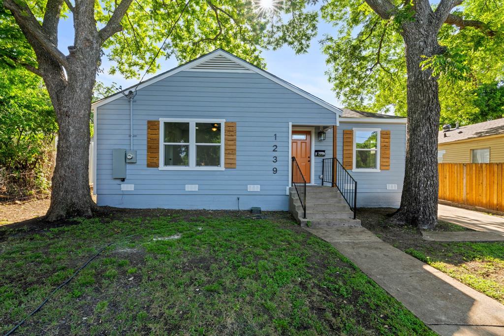 Beautifully Remodeled Home In Sought After West Oak Cliff Neighborhood. Home Has Been Remodeled And Features An Open Concept Living Area With Refinished Hardwood Oak Floors, New Kitchen Cabinets With Eat In Island And Quartz Counters And Stainless Steel Appliance Package, Updated Electrical And Plumbing, Custom Tile Baths With New Tubs, Commodes And Vanities, New Central Heating And Air System. Exterior Has All New Siding With New Windows And  A New Thirty Year Composition Roof With Warranty.