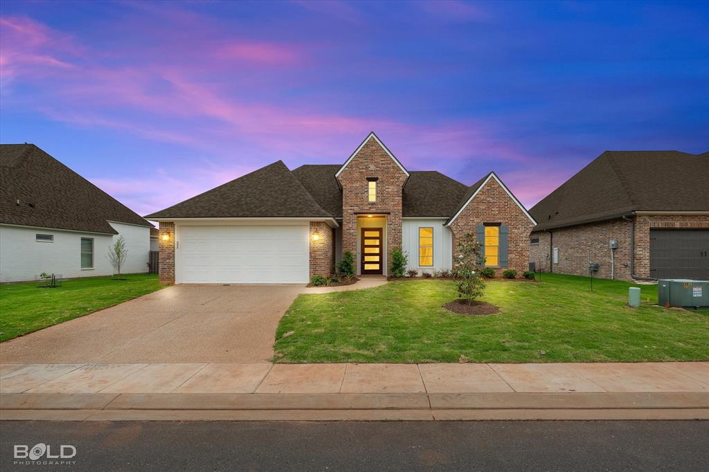 Welcome home to this stunning new construction home located in the exclusive gated community of The Crossing at Wemple in Bossier City. Blending modern elegance with timeless style, this beautifully designed home features 4 spacious bedrooms and 2 full bathrooms with custom finishes and thoughtful functionality throughout. 
The open-concept floor plan creates the perfect space for entertaining, everyday living, and making lasting memories. From the stylish details to the inviting layout, every inch of this home was built with comfort and convenience in mind.
Enjoy peaceful living in a sought-after gated community complete with sidewalks, scenic pond views, and beautiful surroundings — all while being just minutes from shopping, restaurants, schools, and everything North Bossier has to offer. Don’t miss your opportunity to own a brand-new home in one of the area’s most desirable communities!
