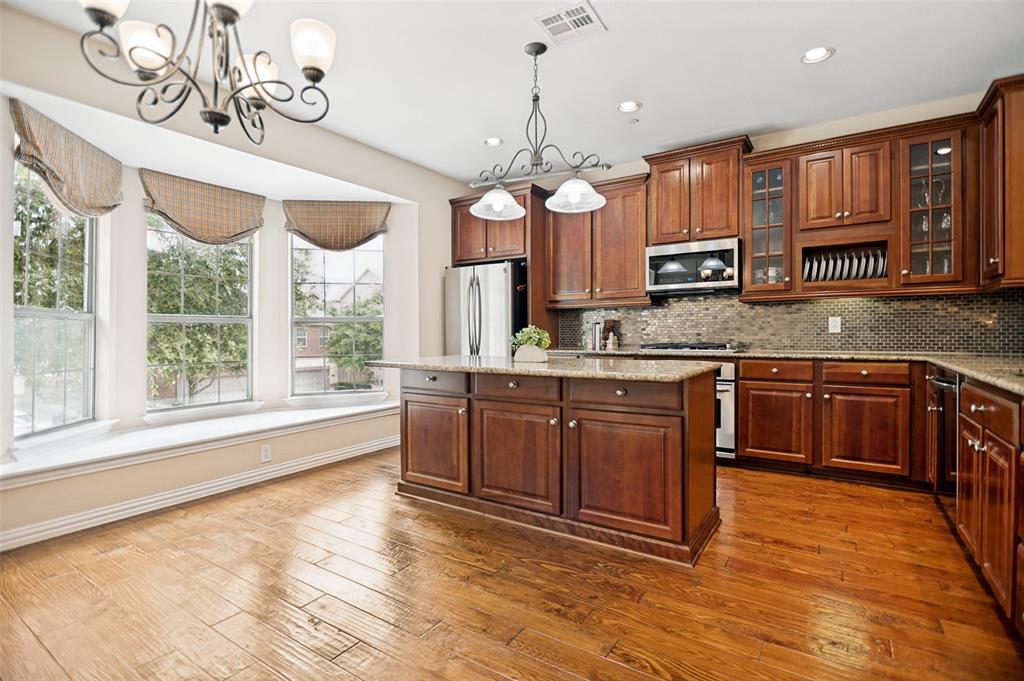 Beautiful three-story townhome offering a flexible and functional floor plan with convenient access to Highway 121, the Dallas North Tollway, and President George Bush Turnpike. The first floor features a spacious flex room suitable for a variety of uses, a half bath, private backyard access, and an attached two-car garage. Buyer to independently verify the feasibility and requirements of converting the half bath to a full bath.

The second floor serves as the main living area and includes an open-concept kitchen, breakfast area, dining space, living room, sunroom, and private patio. Large windows provide abundant natural light, while the sunroom and patio overlook mature trees.

The third floor features two bedrooms, each with its own private bathroom, along with a conveniently located laundry closet.

Conveniently situated near shopping, dining, employment centers, and entertainment destinations, this townhome offers a functional layout and easy access to area amenities.

All information is deemed reliable but not guaranteed. Buyer and buyer’s agent to verify all measurements, schools, taxes, HOA information, property features, and any modifications that may be desired or required.