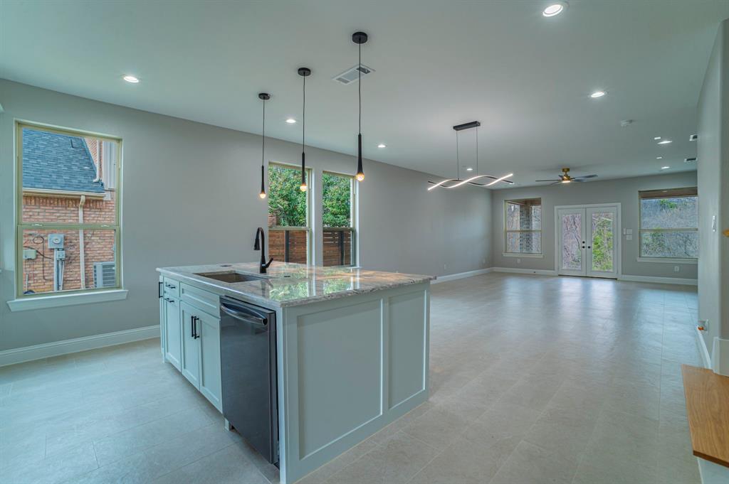 New construction in an established neighborhood, featuring an oversized covered patio ideal for enjoying the backyard and overlooking the greenbelt. Conveniently located near walking trails, this home blends comfort and outdoor living. The kitchen showcases a huge island and opens to the dining and living areas, perfect for entertaining. Glass French doors off the living area allow you to enjoy peaceful greenbelt views and abundant natural light. The downstairs primary suite offers dual sinks, a freestanding soaking tub, and a separate shower. All secondary bedrooms are located upstairs, featuring wood flooring throughout the second floor.