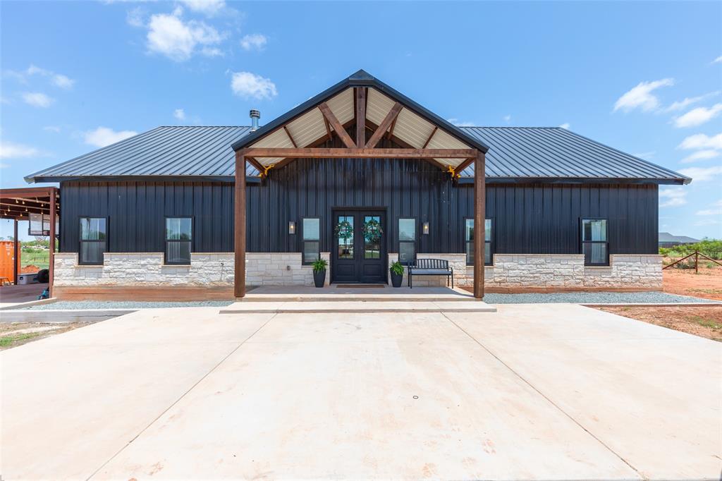 Wow! Check out this stunning custom home on 2.22 acres just minutes from Jim Ned Schools! Offering approximately 3,200 square feet of thoughtfully designed living space, this exceptional property features 5 spacious bedrooms, a dedicated home office, and 2 inviting living areas perfect for family living and entertaining. The beautiful stone fireplace creates a warm focal point in the open-concept living area.
The dream kitchen is sure to impress with its oversized island, convenient coffee bar, 5-burner gas range, and an abundance of features designed for both everyday living and hosting guests. With ample space inside and out, this property offers the perfect blend of comfort, style, and country living with the convenience of being just minutes from town and schools. Don't miss the opportunity to make this incredible home your own!