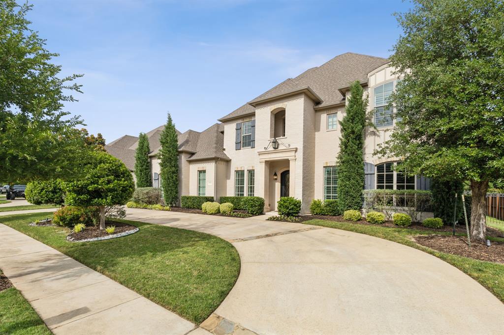 Welcome Home to this beautifully appointed custom masterpiece nestled in the prestigious heart of Southlake. Thoughtfully designed and impeccably crafted, this luxury residence offers the perfect blend of timeless elegance and modern sophistication. From the moment you arrive, you’re greeted by stunning curb appeal, lush landscaping, a circular drive and an inviting entry that sets the tone for what lies beyond.  Inside, no detail has been overlooked. The home boasts soaring ceilings, rich hardwood floors, designer lighting, and exquisite architectural details throughout. The gourmet chef’s Kitchen is a dream come true, featuring top-of-the-line appliances, custom cabinetry, oversized island, walk in Bar with wine storage, all ideal for both everyday living and grand entertaining. The open-concept floor is bather in natural light and boasts a plan flows seamlessly into spacious Family and Dining areas, all bathed in natural light. The luxurious Primary Suite is a true retreat, complete with a spa-inspired bath and large closet.  Private Guest Suite is down with the additional 3 bedrooms upstairs, and all are generously sized, with en-suite baths and walk-in closets.  Enjoy indoor-outdoor living at its finest with french doors leading to a resort-style backyard. The outdoor oasis features a beautiful modern sparkling pool, fully equipped summer kitchen, fireplace, and covered patio — perfect for year-round enjoyment. Located just minutes from Southlake Town Square, top-rated Carroll ISD schools, premier dining, shopping, and entertainment — this home truly has all the bells and whistles.