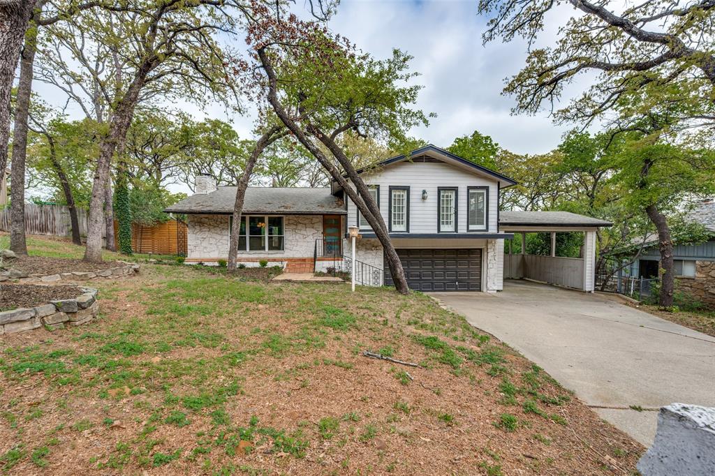 Mid-century modern gem located just minutes from Arlington’s Entertainment District! This 4-bedroom, 3-bath home features a spacious layout with a large kitchen, two primary suites with ensuite baths, and unique architectural charm throughout. Upstairs bedrooms offer private walkout balconies, bringing in natural light and outdoor connection.

Enjoy a huge, tree-filled backyard with mature landscaping and a brand-new deck off the dining area—perfect for relaxing or entertaining. A rare opportunity to own a character-filled home in a prime location!

Up to $2500 lender credit with preferred lender