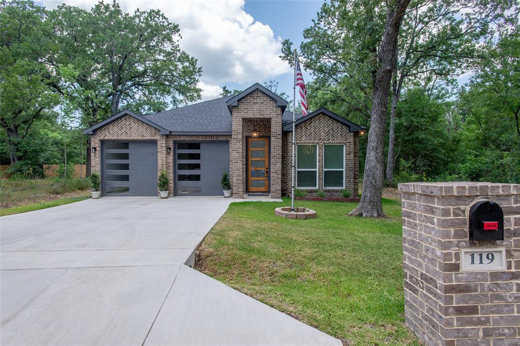Some homes make life feel a little easier the moment you walk through the door and 119 Driftwood Drive in gated Beachwood Estates community has that kind of comfortable feeling. Built in 2025 and still carrying that fresh, barely lived in feel, this 3 bed, 2 bath home offers style, thoughtful design and easy Cedar Creek Lake area living without the wait or uncertainty of new construction. Excellent curb appeal welcomes you first with a clean contemporary exterior and a quiet setting tucked into one of the area’s most loved lake communities. Inside, the home opens with a formal dining area featuring a beautiful accent wall, creating a stylish first impression before flowing into the open kitchen and living space. The kitchen is both pretty and practical with a large center island, quartz countertops, generous cabinet storage and a layout made for everyday life, casual gatherings or slow mornings that deserve a second cup of tea. The spacious primary suite offers a peaceful retreat with a walk in closet and an ensuite bath designed with a true spa like feel, including a large walk in shower. Two additional bedrooms are thoughtfully separated from the primary suite, giving everyone a little extra privacy. A two car garage adds everyday convenience with room for parking, storage, tools, lake gear or weekend projects.
Beachwood Estates is where this home really stretches its value. Affordable HOA dues give you access to community amenities including a park, pool, boat ramp, fishing, pickleball court, playground, and clubhouse. Whether you are looking for a full time East Texas home, a low maintenance Cedar Creek Lake getaway or a comfortable place to settle into a slower pace, this home offers the perfect blend of comfort, community amenities and relaxed lake area living. If you have been looking for a nearly new home with modern style, community amenities and easy access to the Cedar Creek Lake lifestyle, 119 Driftwood Drive is ready to welcome you home.