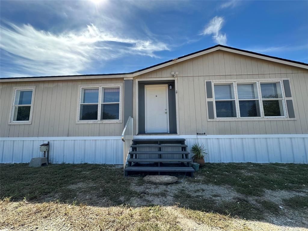 Welcome to your newly updated and spacious home on a 1-acre lot, just minutes from Lake Granbury! Everything in the home has been redone and lives likes its brand new with new roof, HVAC and ducts, carpet, paint, newly polished and stained cabinets, new porch steps, gate and wire fencing. This home boasts over 2000 sq ft and features a split bedroom set up with three beds and two baths on one side of the living-kitchen-dining areas and the primary ensuite on the other side. The home is open and light filled with generous bedrooms and large closet spaces allowing for plenty of storage. Outside, the expansive 1-acre lot offers plenty of room for outdoor activities. Located on the north side of Granbury, perfect for easy travel north and just 10 minutes from town with abundant shopping and restaurants, the home is also just a short 10-minute drive to Lake Granbury. This property combines peaceful country living with easy access to shopping and recreational amenities.