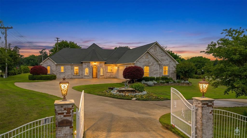 This impressive 2,725 sq ft corner estate sits on a beautifully landscaped, oversized lot designed for both privacy and elegance. A gated entrance with private electric access and a sweeping concrete circular driveway creates a grand first impression and enhances curb appeal.  The 36x23 three car garage protects your cars and toys.

Step inside through a striking decorative metal front door to a light-filled main living area featuring formal spaces ideal for hosting and everyday comfort. The open-concept design flows seamlessly into an oversized kitchen with a breakfast bar and two distinct dining areas—perfect for casual meals or formal gatherings. A spacious den offers an expansive area for relaxation or entertaining.

The luxurious 21x16 primary suite serves as a private retreat, complete with a 15x14 spa-like bath featuring a jetted tub, separate shower, and an impressive 15x14 walk-in closet. Generously sized secondary bedrooms, including a 20x16 room, provide flexibility for guests, office space, or hobbies.

Outdoor living is truly exceptional, with a covered patio equipped with automatic shades for comfort and a meticulously maintained yard ideal for hosting weddings, celebrations, or large gatherings. Multiple electric gates and abundant parking ensure convenience and security.

Blending refined indoor living with extraordinary outdoor space, this one-of-a-kind property offers a rare opportunity for those who love to entertain in style and remember the generator is always ready to keep any party going.