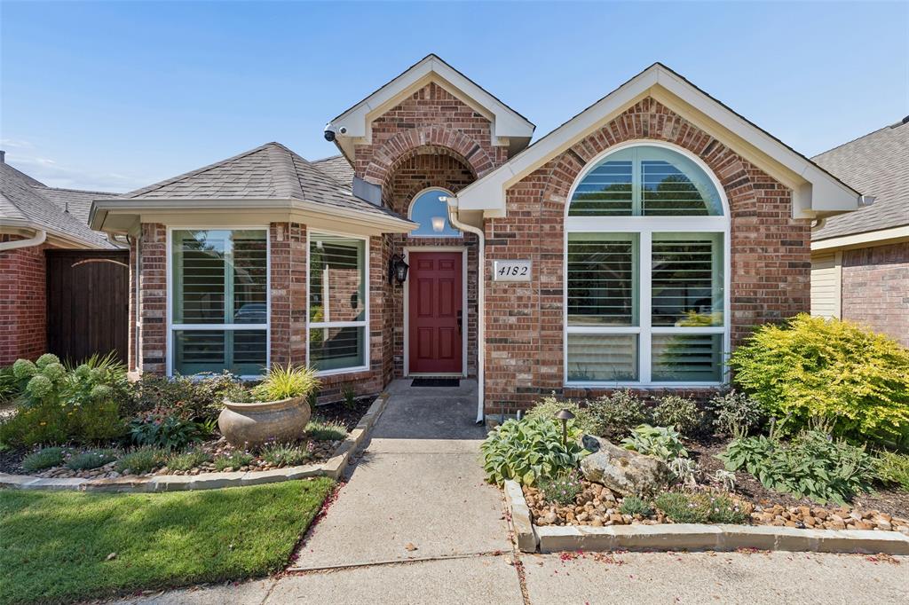 Beautifully updated 3-bedroom, 2-bath home with a study, beautifully landscaped backyard, and custom covered patio in desirable North Dallas and Plano ISD. The open floor plan features soaring ceilings, rich wood flooring, a fireplace with decorative tile surround, and abundant natural light. The updated kitchen offers granite countertops, stone backsplash, refreshed cabinetry, modern fixtures, SS appliances and opens to the breakfast area and spacious living room, creating an ideal space for everyday living and entertaining. A versatile front room can serve as a private study or formal dining room. The split primary suite includes dual sink granite vanity, a soaking tub, separate shower, and a spacious walk-in closet. Additional features include plantation shutters, an upgraded HVAC system, tankless water heater, and impact-resistant roof. The backyard is designed for year-round enjoyment with a custom covered patio, professional landscape lighting, cedar privacy fence, retaining wall, mature landscaping, stone-bordered flower beds, and charming garden walkways. Conveniently located near parks, walking trails, shopping, dining, and major highways, this move-in-ready home offers an exceptional North Dallas location.