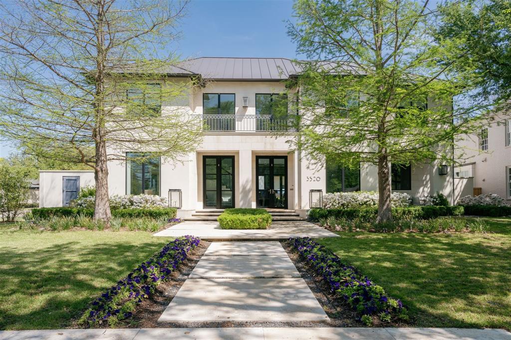 This stunning French modern home, built by Ellen Grasso on an oversized corner lot with rare 82-foot frontage, perfectly embodies the University Park lifestyle; characterized by tree-lined streets, serene parks, top-tier schools, architecturally significant homes & its traditional charm; with block parties & holiday parades; with easy access to Dallas’ social scene, luxury shopping & dining. Timeless cast stone & stucco exterior, iron balconies, gas lanterns, & manicured flower beds lead you to stately glass & iron front doors. A sophisticated foyer with soaring ceilings, sleek glass railing, Italian vintage chandeliers & dark wood flooring. The expansive great room with 12ft coffered ceilings, opens to a Parisian-style kitchen with lounge & fp, a breakfast banquette, & side yard dog run with a tranquil water feature. The gourmet kitchen features Calcutta Oro marble, a 15ft island with trough sink, Wolf range, glass-paneled Sub-Zeros, & Miele coffee station. The 1st floor media room & hidden bar, equipped with a large screen, projector, & upholstered walls, are perfect for hosting Super Bowl parties or movie nights. Multiple doors open to an outdoor covered patio with fp & weather enclosed tv, resort-style pool with a stunning water wall, spa, & summer kitchen. Upstairs, a luxurious primary suite, three or four ensuite bedrooms, game room, wet bar, laundry room, & multiple balconies. The primary suite features vaulted ceilings, a fp, & striking fixtures. The primary bathroom features a soaking tub, makeup vanity, & spacious shower with body sprays. Separate custom closets with a glamorous mirror-topped island, acrylic hardware, chandeliers, & illuminated display shelving. This exquisite custom retreat is a must see.