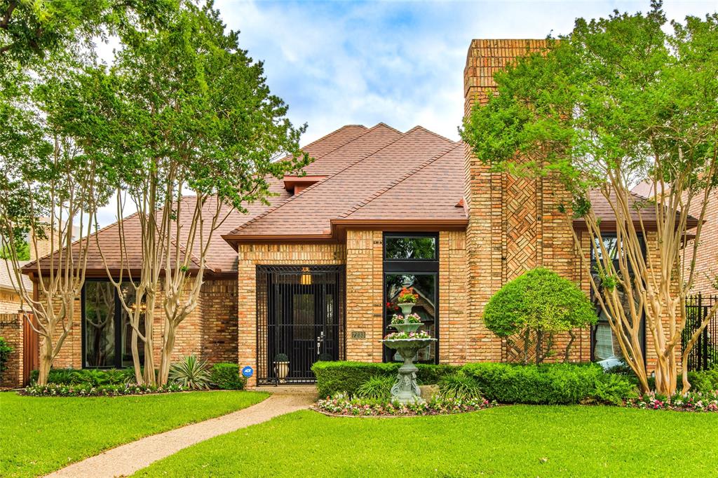 Come Experience this charming, timeless beauty, nestled on one of the premier wooded streets in Waterford on the Park. This secluded neighborhood offers a community pool, walking & jogging path, private lake and tennis court and is ideally located within the LBJ inner loop with convienent access to shopping, dining, hospitals, airports & more.  A Beautiful home offering both convenience and exceptional curb appeal.  From the moment you arrive, you'll be captivated by the lush landscaping, mature trees, and striking windows that create a truly unforgettable first impression. Inside, discover an inviting layout filled with warm, relaxing spaces designed for both everyday living and entertaining in true Texas style. The impressive great room offers the perfect gathering place, while the beautifully remodeled kitchen features a cooktop framed by a stunning brick alcove, cherry wood cabinets, blending character and functionality seamlessly. The charming breakfast area showcases a wall of custom built-ins and opens through French doors to an extraordinary cobbletone patio surrounded by lush greenery and complete privacy-an idyllic setting for quiet mornings or intimate evenings outdoors. The luxurious primary suite is a peaceful retreat, complete with its own fireplace, private patio access, and a beautifully updated spa-inspired bath and custom closet. A versatile front flex space offers endlss possibilities and can easily serve as a second dining area, private office, or additional living space. Throughout the home, you'll appreciate the abundance of storage and thoughtfully designed built-ins. Upstairs, two generously sized bedrooms, and a spacious remodeled bath, provide comfort, and complete this exceptional home. Come see this timeless retreat for yourself and experience the warmth, character, and beauty this home and neighborhood has to offer.