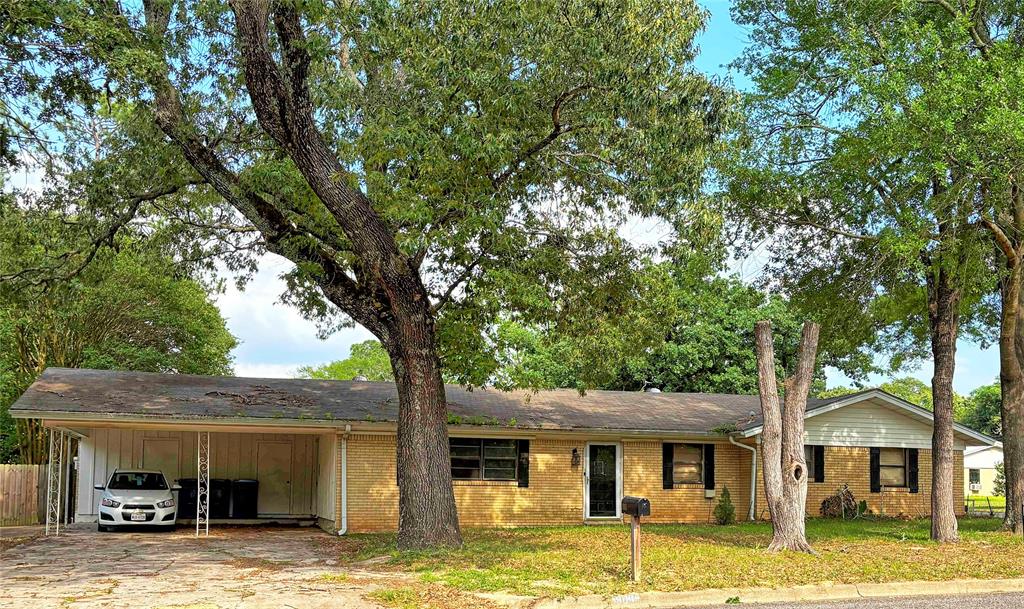 3 bedroom 2 bath home on corner lot great for first-time homebuyers with mature oak and pecan trees in front yard, including peach and crepe myrtle trees in back yard, covered back patio, storage building, and spacious backyard perfect for entertaining guests. Conveniently located near TVCC and the Country Club. Property has European oven, new furnace and new A C unit both installed in January 2025. Property offers oversized master bedroom with room for sitting area, remodeled master bathroom, and new paint throughout part of the home. Front and back yards boast concrete pads for RV or boat parking. Selling property as-is.