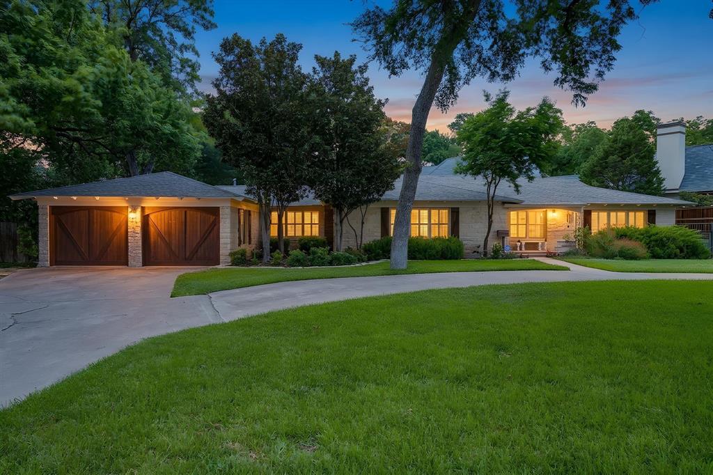 This is your opportunity to live directly next to Colonial Country Club. Whether you're looking to move right in, update the existing home, or build your dream home, it's hard to beat this location. Sitting on a beautifully treed .60 acre lot, this spacious ranch is filled with natural light and offers hardwood floors, two fireplaces, generous living spaces, and a hidden office that's perfect for working from home. The kitchen opens to multiple gathering areas, making the home ideal for entertaining or everyday living. The primary suite features its own fireplace, steam shower, jetted tub, dual vanities, and a large walk in closet, while the split secondary bedrooms provide privacy for family or guests. Step outside to a peaceful backyard with mature trees and a stone patio, creating the perfect place to unwind. Just minutes from TCU, Clearfork, downtown Fort Worth, and some of the city's best restaurants and shopping, this is a location that rarely becomes available.