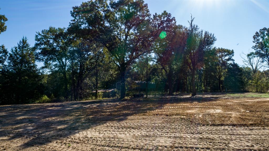 Tucked away in the heart of the countryside, this stunning 18.54 MOL acre wooded retreat offers the perfect balance of privacy, nature, and convenience. A cleared homesite is already in place, making it easy to start building your dream home, weekend cabin, or recreational getaway. Surrounded by mature trees with a peaceful pond, the property creates a serene setting ideal for relaxing, exploring, or enjoying the outdoors. With electric, water, septic, and propane already installed, much of the groundwork has been done for you. A barn and carport provide ample space for equipment, storage, hobbies, or outdoor toys. Located in Rains ISD and just minutes from both Lake Tawakoni and Lake Fork, this property offers endless possibilities for fishing, boating, hunting, or simply escaping the hustle of city life. Whether you’re looking for a private homestead, investment opportunity, or weekend retreat, this versatile East Texas property is ready to bring your vision to life.