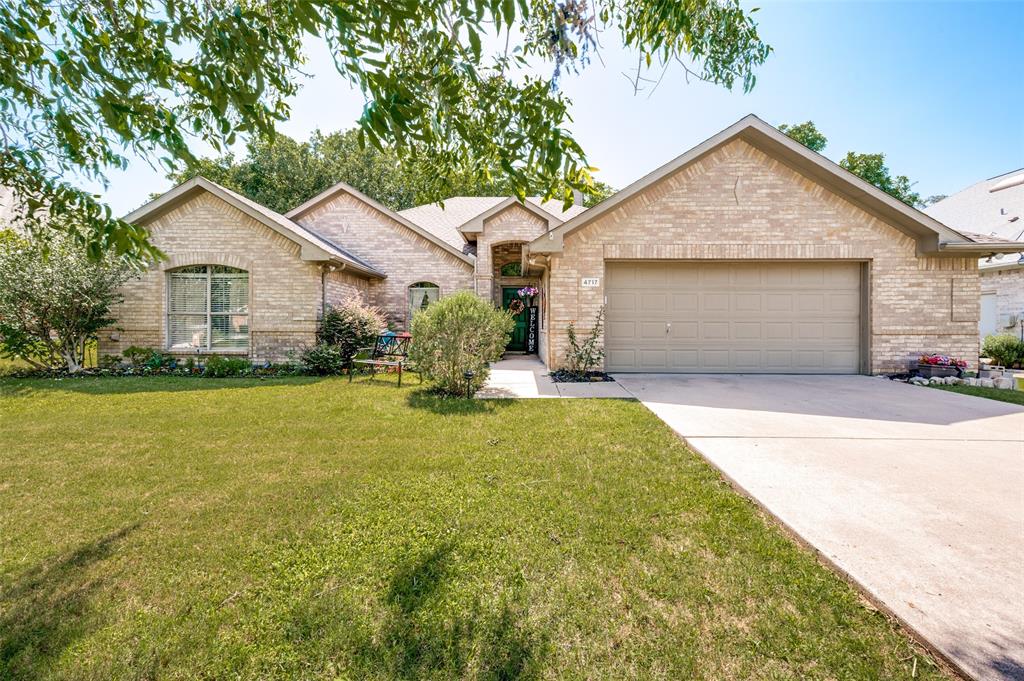 Buyer backed out due to cold feet. No inspection was done, no fault of the seller. Back on market and ready for the next buyer to make this house their home! Beautifully maintained 2,100-square-foot home with exceptional curb appeal, nestled in a quiet and established Flower Mound neighborhood. From the moment you step inside, you'll appreciate the spacious open layout, rich wood flooring, impressive custom millwork, and abundant natural light pouring through oversized windows.

The heart of the home is the expansive kitchen, featuring Corian countertops, stainless steel appliances, 42-inch stained wood cabinetry, a large center island, and plenty of workspace for cooking and entertaining. The inviting living room showcases a stunning decorative stone fireplace, creating the perfect gathering space for family and friends.

Retreat to the beautifully updated primary suite, complete with dual vanities, an oversized walk-in shower with body sprays, and a generous walk-in closet. Outside, enjoy your own private oasis with mature shade trees and a covered patio overlooking the backyard—ideal for relaxing evenings, weekend barbecues, and year-round entertaining.

Pride of ownership shines throughout this move-in-ready home. Conveniently located near top-rated schools, parks, shopping, dining, and everything Flower Mound has to offer. This is one you won't want to miss!