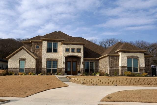 WATERFRONT LUXURY WITH RESORT-STYLE POOL IN GATED LAKE RIDGE! Nestled behind the gates of Lake Ridge and zoned to Midlothian ISD, this stunning waterfront home offers breathtaking pond and fountain views, soaring ceilings, abundant natural light, and an open-concept design perfect for entertaining. Featuring 4 bedrooms, 5 baths, and a 3-car garage, the chef’s kitchen includes premium Signature appliances, built-in refrigerator, gas cooktop, double ovens, pot filler, oversized island, and custom cabinetry. Spacious living area with stone fireplace overlooks the heated pool, spa, outdoor kitchen, and private backyard oasis. Luxurious primary suite features patio access and spa-inspired bath with oversized wet room, soaking tub, walk-in shower, and custom closets. Dedicated media room with wet bar, private office, pool bath, security cameras, generator-ready setup, luxury vinyl plank flooring, and 500 sq ft unfinished expansion space upstairs. Recently improved price — motivated sellers!