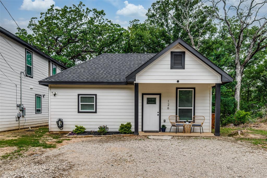 Nestled just minutes from the shores of Cedar Creek Lake, this beautiful single-story home offers the perfect blend of comfort, style, and easy lake-area living. Featuring 3 bedrooms and 2 full baths across approximately 1,350 square feet, the open-concept layout is designed for both everyday living and entertaining. The spacious living area flows seamlessly into a bright, modern, eat-in kitchen complete with quartz countertops, built-in cabinetry, and a pantry—creating a functional and inviting heart of the home. The primary suite offers a private retreat with an ensuite bath and walk-in closet, while two additional bedrooms provide flexibility for guests, family, or a home office. Durable luxury vinyl plank flooring, decorative lighting, and neutral finishes throughout give the home a clean, contemporary feel. Step outside to enjoy the covered front porch or relax in the fenced backyard with room to unwind. Located in the Cherokee Shores community, residents have access to amenities including a community pool and playground, all while being just a short drive to lake access, dining, and recreation. Whether you're looking for a full-time residence, weekend getaway, or investment opportunity, this home delivers exceptional value and lifestyle near Cedar Creek Lake.