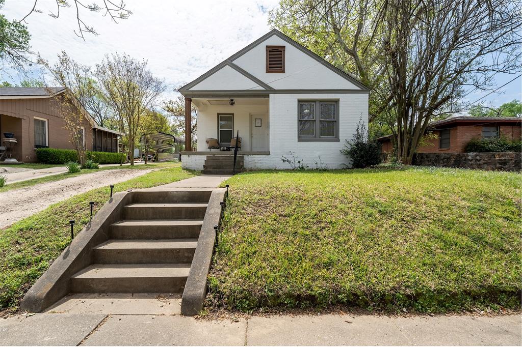 Timeless 1930s Charm in the Heart of Tyler, Step back in time and into comfort at 818 W Rusk Street, a stunning 1939 built cottage that perfectly captures the historic soul of Tyler, Texas. This 3 bedroom, 1 bathroom gem offers the rare blend of vintage character and the serene, established landscape that only decades of growth can provide. There remains a functional historic gas lamp that illuminates the backyard. As you arrive, you’re greeted by a symphony of specimen trees that offer beauty in every season: A towering old oak tree anchors the property, providing deep shade and a sense of permanence, Japanese Maples, classic Dogwoods, and blooming Crape Myrtles create a private, picturesque backdrop for your morning coffee or evening wind-down. Whether you’re enjoying the breeze on the oversized front porch or watching the children play the expansive backyard, this home was designed for outdoor living. The home retains the cozy, storybook feel of the late30s. Every corner radiates warmth, from the natural light pouring through original rope pully style windows to the thoughtful layout. Flexible spaces that can easily serve as a home office or creative studio. The location is nestled in the 75701 zip code, you’re minutes away from Tyler’s vibrant downtown, local boutiques, and the historic Azalea District. Homes with this level of established landscaping and historic integrity are a rare find in the current market. It’s not just a house; it’s a piece of Tyler history.