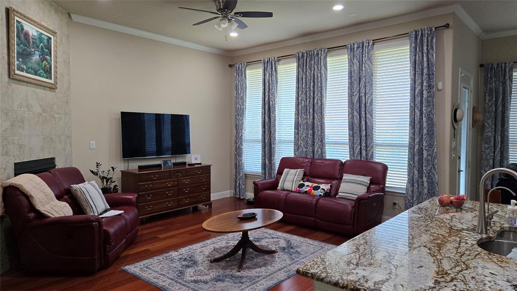 Beautiful move in ready home. 
Convenient to George Bush, Central Expressway and DNT. 
Elegant kitchen, family room and Nook all open and overlooking the backyard. High 11' ceilings in entry hallway, dining, kitchen, family and nook. Great ambience with tall ceilings all around.
Brazilian Cherry Engg hardwood flooring in the hallway, dining and family room. 
Gorgeous kitchen with gas cooktop, Quartz Kitchen counter and Natural designer granite island, built in oven and microwave large pantry, huge island and breakfast bar. 
Formal dining room off kitchen. The family room has a corner fireplace and floor to ceiling windows. 
Front two Split bedrooms with bath in the middle having shower convenient for elderly people.
Large primary suite with garden tub, separate shower, dual vanities and walk in closet. 
Another lovely bedroom and bathroom close by right next to master bedroom. Convenient for families with younger kids. 
Large fenced backyard with covered patio. 
Two car garage with openers. 
Wonderful community with dog park, pools, play areas and walking trails.
Smart home features like some lights can be remotely controlled and automated, Ring security system installed with door camera, crystal chandelier in dining, garage steel roof rack. Front permanent christmas lights installed.