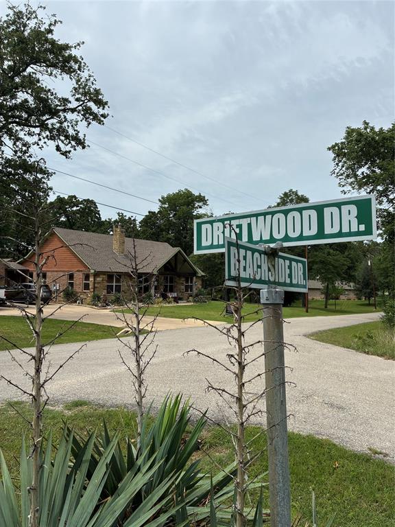Short Term Rentals ARE PERMITTED! This exceptional lot is within a 7 minute walk to a lively POA park. A newly renovated boat ramp on a wide water channel is the main attraction. There is a community swimming pool with fantastic open water views conveniently outside of the clubhouse. Surrounding the swimming pool and playground is a shoreline retaining wall with concrete paths for leisurely walks and fishing. Several pedestal charcoal grills provide opportunities for several groups to congregate and share meals. There is a tennis and pickle ball court with regular games organized by residents. This community exhibits a serious commitment to the lake lifestyle. Beachwood Estates is a private community with a front gate that offers an elevated level of security where a property owner must grant access to a visitor via mobile their mobile device. This community exhibits a serious commitment to the lake lifestyle. Almost the exact same distance from both Dallas and Tyler, TX clocked at 1 hour and 5 minutes. Located in the highly rated Malakoff ISD.