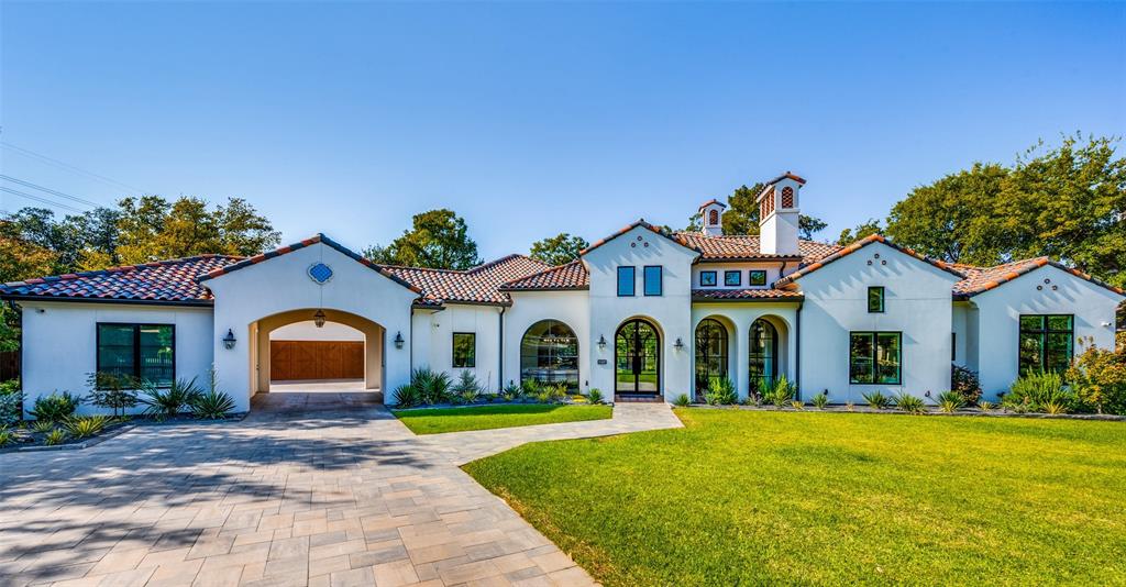 Discover sophistication with this single-story marvel in a coveted Dallas neighborhood. This 5-bedroom, 5.2-bath residence seamlessly blends classic charm with modern luxury. Rich wood floors lead through an open floor plan with high ceilings and expansive living areas. The gourmet kitchen boasts top-tier appliances including a Wolf 6-burner range, Cove dishwasher, Miele coffee maker, and Sub-Zero refrigerator. A walk-in pantry and dedicated wine room cater to culinary enthusiasts. The thoughtful design includes a primary suite with a private utility room, a study with custom bookshelves and sliding glass doors, a state-of-the-art media room, and a game room with a fully-equipped bar. Outdoor living shines with a screened patio featuring a fireplace, built-in grill, and year-round comfort amenities. The backyard oasis offers a serene pond, sparkling pool, and spa. 
Additional luxuries include dual interior fireplaces, a three-car garage plus an extra single-car garage, and a porte-cochere. This gorgeous home is a canvas for sophisticated living where every day feels like a vacation.