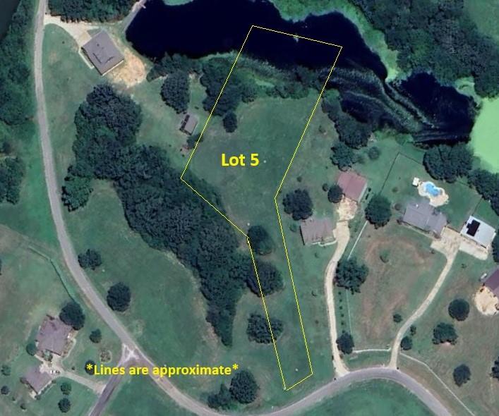 Build your dream home in the highly sought-after Lake Fork Ranches at Star Ranch! Lot 5 on County Road 1300 offers 2.191 acres of peaceful East Texas countryside with a beautiful private pond setting and close proximity to world-famous Lake Fork. This unique property sits back from the road, allowing you to create a homesite tucked behind mature trees for added seclusion from the road and charm. The lot is level and ready for construction, making it an ideal canvas for your custom home or weekend retreat. Enjoy the best of both worlds—quiet country living with the convenience of being just minutes from Lake Fork’s renowned fishing, boating, and outdoor recreation. Whether you're ready to build now or planning for the future, this property offers location, privacy, and natural beauty all in one. Don’t miss this opportunity to own a slice of East Texas paradise!