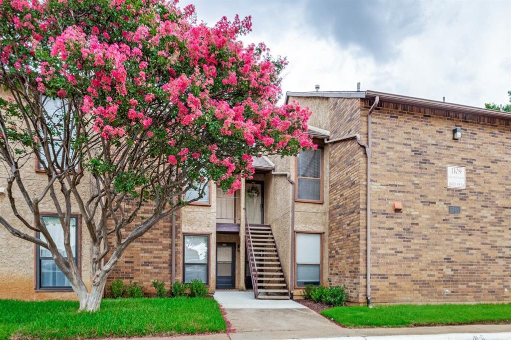 Soaring Ceilings greet you in this light and bright two bed two bath in this Fabulous Lock and Leave Community in North Arlington! Gated Community offers 3 Pools, Tennis, Pickleball Courts, Indoor Racquetball, Jacuzzi, Indoor Sauna and Fitness Room. Walk to La Mad for Breakfast! Porcelain Tile floors grace the floors and add to the ambiance. Large kitchen offers rich granite counters, recently painted cabinetry, updated stainless steel dishwasher, microwave and range, pantry and storage for the cook! Separate Dining area is perfect for entertaining. Living room offers ample room for large pieces and boast a vaulted ceiling, all popcorn removed, and canned lighting added with dimmer! Enjoy a cozy evening by the wood burning fireplace. Granite counters were added to both bathrooms as were the commodes and faucets. Both bathroom cabinets were also painted. Custom Elfa shelving was added to the closets. The primary suite boasts two closets and an oversized area for large pieces, office area or reading nook. The gorgeous ensuite bath a remodeled separate shower, lounging tub and private water closet. Enjoy coffee on your covered patio. A large storage closet is a bonus. Fridge and Washer Dryer to remain! The Cloisters offers so much! Onsite management, grounds maintenance, water, sewer, trash, pest control and full use of all facilities. Two gated entrances. Two reserved parking spaces in front of condo. Fantastic for commuters to Dallas or FW or those looking for an intown spot for the sports and entertainment enthusiasts. Take a tour of this inviting home today!