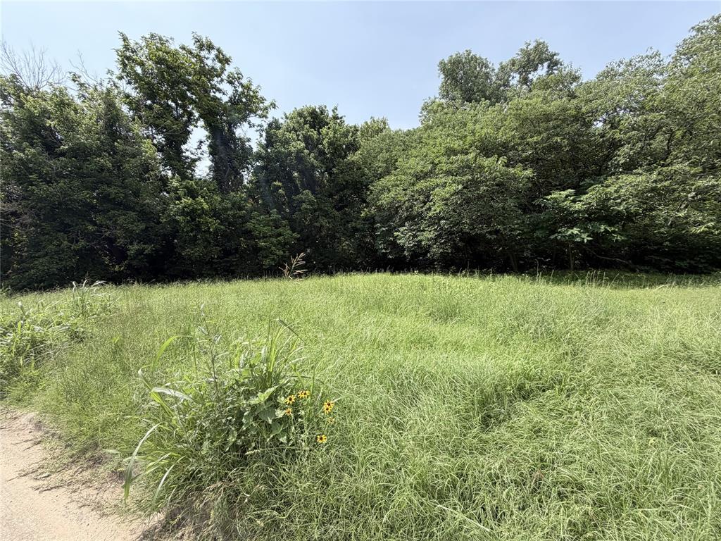 Vacant residential lot consisting of three platted lots (Lots 5, 6 & 7, Block 73, Millers 2nd Addn). Located within Denison city limits, offering an excellent infill opportunity for new construction. Convenient access to schools, shopping, and major highways. No HOA and no known restrictions. Utilities available at street (buyer to verify). Ready for development.