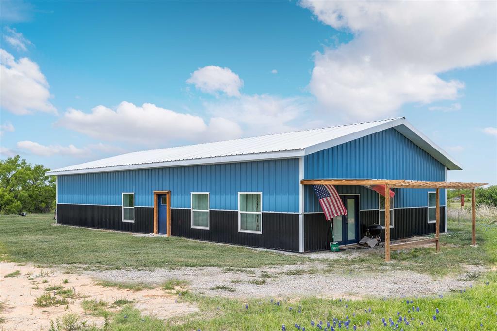 Discover modern living in this beautifully crafted 2-bedroom, 2-bathroom metal-framed barndominium, built in 2024 (per seller). Designed with both style and functionality in mind, this home features an open-concept layout highlighted by impressive 16-foot vaulted ceilings, creating a spacious and airy feel throughout. The contemporary kitchen is a true centerpiece, complete with stainless steel appliances, a large breakfast bar, and ample space for entertaining or everyday living. The generous primary suite offers a private retreat with a walk-in closet and a well-appointed en-suite bathroom. An attached 24’ x 40’ two-bay garage provides incredible versatility, featuring a matching finished floor—ideal for converting some additional space into a third bedroom, office, or additional living space to suit your needs. Situated just one mile west of Bangs and set back off the road, this property offers both convenience and privacy, making it the perfect blend of peaceful living with easy access to town.
*Buyer's agent and buyer to verify details and room sizes, boundary lines on photos are estimate.