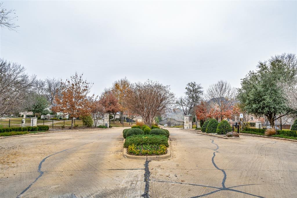 Beautiful, almost .75 of an acre lot in the prestigious, gated neighborhood of The Timbers of Lake Ridge. Bring your builder and build your dream home surrounded by nature & tranquility with Midlothian ISD schools, Ellis County tax rate, and no time limit to start building. Lake Ridge features Tangle Ridge Golf Course, an 18-hole championship golf course, and multiple parks headlined by Valley Ridge Park. This park has a stocked fishing pond with a pier, a 1.5-mile paved trail, four playgrounds, and sports fields. Enjoy quick access to Joe Pool Lake, Lynn Creek Marina, and Cedar Hill State Park. The marina features a driving range, a 97-passenger rental boat, and the Oasis restaurant. You'll be 30 to 45 minutes to downtown Dallas, Ft. Worth, DFW Airport, A&T Stadium, Globe Life Park, and Texas Live. Come take a look!