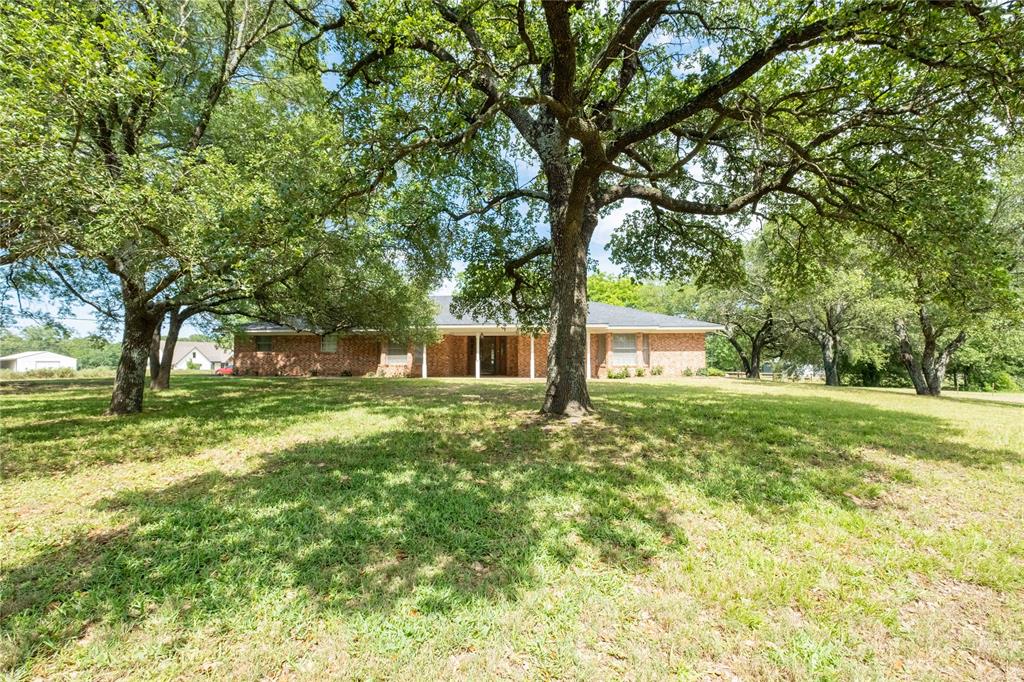 Situated on 1.34 beautiful acres between Pittsburg and Mount Pleasant, this property offers a great combination of room to spread out, everyday comfort, and convenient access to both towns! With over 2,500 square feet, this 3-bed, 2-bath home is packed with the features buyers are looking for. The oversized living room is truly the centerpiece of the home, offering ample space for entertaining, hosting family gatherings, or simply relaxing at the end of the day. The sunroom creates the perfect flex space for morning coffee, reading, hobbies, or enjoying peaceful views of the property year-round. Step outside and enjoy the large covered front porch — an ideal place to unwind and take in the quiet country setting. The oversized two-car garage provides not only parking but also ample storage and could easily be converted into additional heated and cooled space or used as a workshop, while still having access to the attached 2-car garage! If you’ve been looking for a property with acreage, usable space, and a location that keeps you close to both Pittsburg and Mount Pleasant, this property deserves a look!