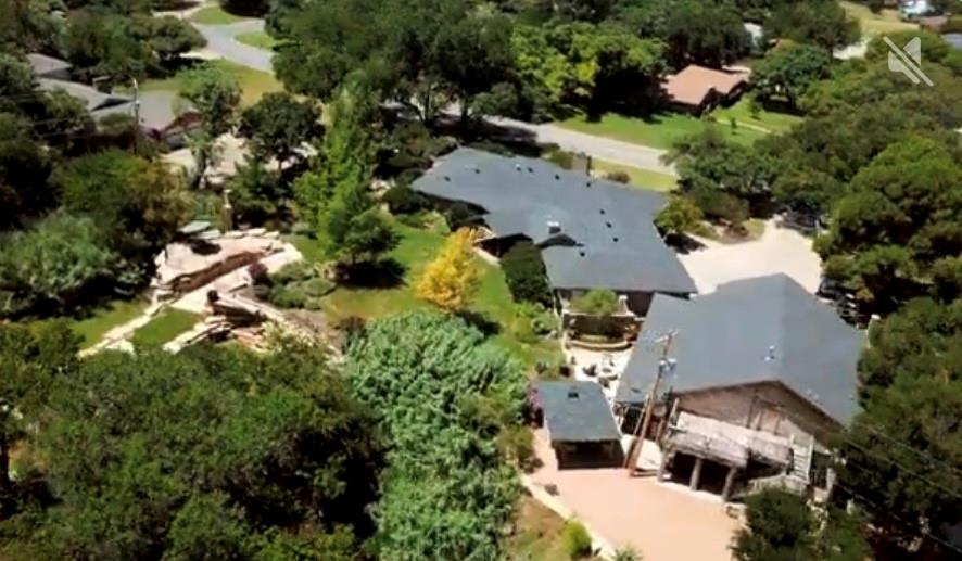 Executive Resort!! Texas Style!! This one of a kind estate blends rustic charm with modern luxury. This property features 3 distinct homes each crafted with its own style.  Outdoor living is the center of this property design with two outdoor kitchens, spacious covered patios and multiple dining and lounging areas designed for year round entertainment. Two fire pits offers the perfect spot to gather under the Texas stars or to enjoy the sound of a cascading waterfall off you porch. This 1.42 acre lot  gives you a chance to stroll down rock pathway to  a pergola area for a quiet creek retreat.  The main house is a sprawling one story, warm yet elegant home. Warm accents, rich mesquite wood floors, a stone accent wall and stone fireplace create a loving family gathering place.. This is a huge room opening into the dining rooms and kitchen. Granite gourmet kitchen with gas stove, wine refrigerator and ice maker. Attached to the main house is the new almost complete 1 bedroom one bath apartment. Pictures to come when finished. It boasts a den and island kitchen all in one room with a wall of windows.  If the outdoor living spaces doesn't grab your heart, then the MANCAVE will!   This mancave is straight out of a Texas Hunting lodge. Upon entry you are greeted by a 2 story high red cedar ceiling, stone walls and mounted game trophies. Lions tigers and Bears OH MY !!  A stone fireplace is the center of this massive room with an open bar kitchen. The bathroom showers are crafted out of stone and walls and staircase  carve wood. The mancave can sleep up to 13 people. Covered carport can fit 4 cars but the driveway  can park 17 pick ups. This can be your resort home .This estate is more than a home, it's a destination, offering friends, family a chance to relax and experience the best of Abilene. The  Mancave is 2322 sq ft  of living space not included in listing.  A property video can be found on YOUTUBE  under Don and Debbie Steeles Rental Property at 1201 Leggett Dr.