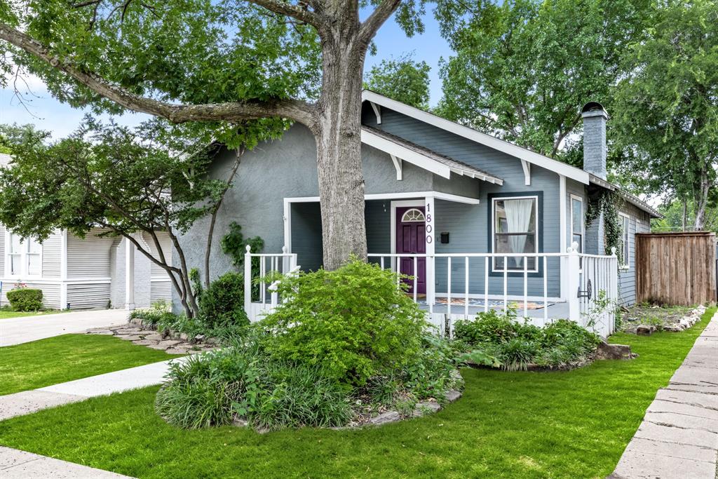In the heart of one of Fort Worth’s most beloved neighborhoods, this timeless Craftsman delivers the kind of character and authenticity that simply can’t be replicated. A wide, welcoming front porch sets the tone before opening to an interior rich with original details - gleaming original hardwood floors and the kind of craftsmanship that has stood the test of time. The living and dining spaces strike a rare balance between historic charm and everyday livability, creating inviting spaces for both entertaining and quiet evenings at home. At the back of the home, the thoughtfully updated kitchen combines classic style with modern function. A generous island anchors the space, complemented by a Jenn-Air downdraft cooktop, stainless steel appliances, and an exceptionally well-designed pantry featuring extensive pull-out storage - a luxury seldom found in homes of this vintage. Beyond the kitchen, an elevated deck overlooks a storybook backyard framed by mature landscaping and shaded greenery. Tucked away at the rear of the property, a fully wired workshop or studio offers endless possibilities for artists or creative pursuits. The primary suite offers one of the most coveted features in a historic home: a true walk-in closet - Beautifully finished and spacious, it provides modern convenience without sacrificing the home's original character. The updated bathroom showcases an authentic clawfoot tub that feels perfectly at home within the residence’s historic pedigree. The secondary bedrooms are equally charming and inviting. Just blocks from the cafes, restaurants, and boutiques of Camp Bowie and minutes from the acclaimed museums of the Cultural District, the location places the very best of Fort Worth right at your doorstep. Rarely does a home so effortlessly combine architectural character, thoughtful updates, and an exceptional location.
