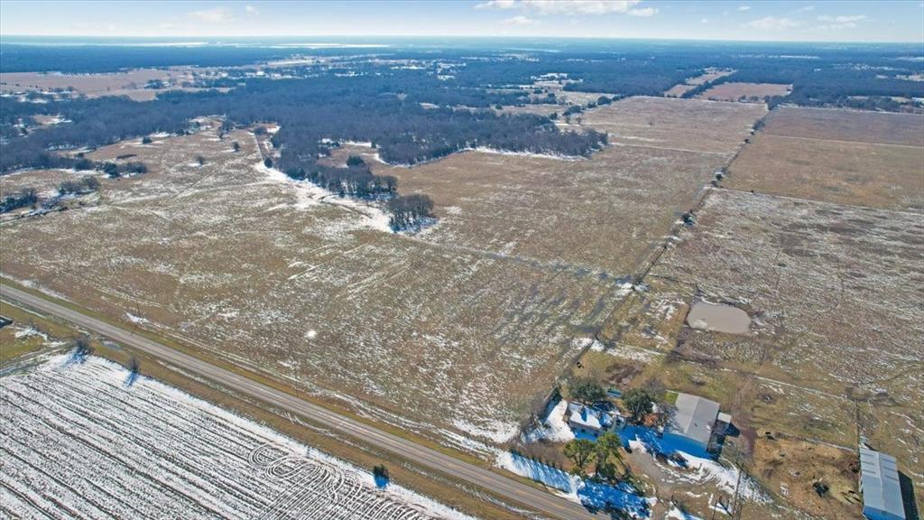 Awesome opportunity to own 247 acres of serene gorgeous land with just the right amount of trees and pasture. Nestled in famous Fannin County, this expansive piece of Texas is a perfect for privacy, future security and potential for so many things! A savvy investor may buy just to hold against ever increasing land prices. Enjoy gentle varied terrain, wide open spaces, big old pond, and stunning Texas skies! Dozens of ideal settings for your home. Whether you want a barn-da-minium, a custom or manufactured home or to create your ranch or hobby farm, this is Your Green Acres! Perfect place to get away from it all yet only minutes to town or to one of the many lakes and recreational areas. Agricultural exemption in place!! This land is perfect for easy country living with the convenience of nearby towns, museums and everything from relaxing parks to rodeo round ups and so much more! Also, don't miss the once a month famous Bonham Trade Days! Y'all come! NOTE, See MLS #'s, 21164414, 21170534, 21171048, 21171053. These 4 make tracts make and up the 247 acres seller will accept offers on them as long as the 247 has not gone to contract.