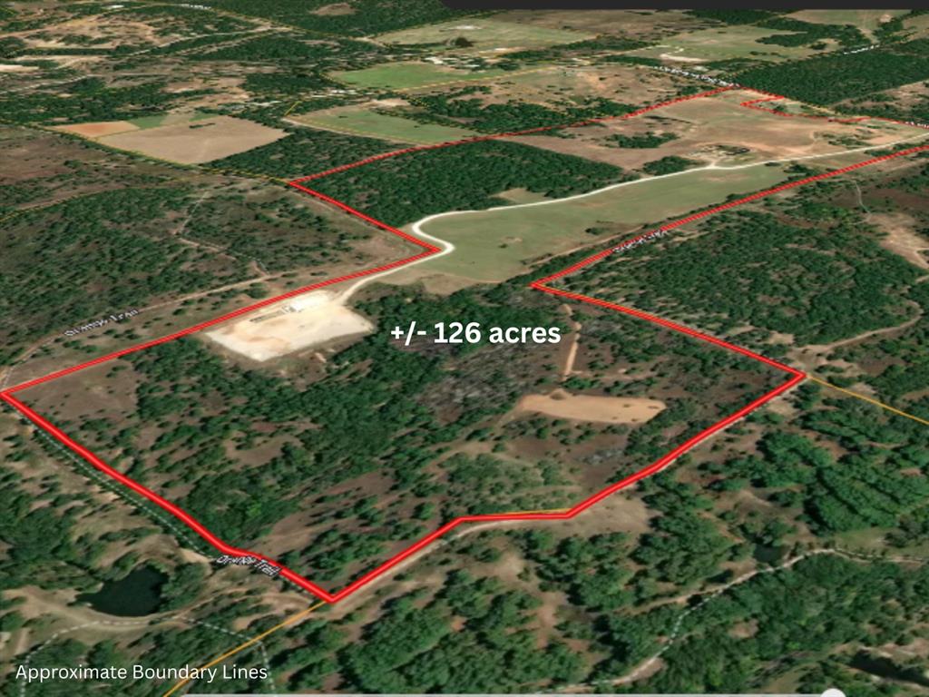 RARE OPPORTUNITY to own a legacy ranch bordering the Lyndon B. Johnson National Grasslands, where horses, cattle, and wide-open Texas skies create a lifestyle impossible to imagine! This AG exempt blend of open coastal pasture ideal for hay production, and natural terrain provides versatility for ranching, livestock, or recreational use. With the National Grasslands bordering the property, outdoor enthusiasts will appreciate direct access to opportunities for horseback riding, hiking, camping, wildlife watching, and exploring the great outdoors. The expansive setting offers incredible privacy while still being conveniently located near town. Offered for sale for the first time in over 100 years, this remarkable plus minus 126acre ranch presents a rare opportunity to own a legacy property where the seller is willing to convey all mineral rights owned with an acceptable offer. Located just NW of the Dallas Fort Worth Metroplex. The land features a variety of terrain with beautiful stands of pine, cedar, and mature oak trees on mostly fine sandy loam, creating a scenic and private setting. Two productive coastal pastures provide hay production, typically yielding two cuts per season. Last year one cut yielded about 52 bales averaging approximately 1,100 lbs. each. Water resources include two tanks, a natural spring, and a watershed. The property is fully fenced and well maintained, with firebreaks along portions of the perimeter. BONUS, the property includes a 1683 SF brick home with about 1.5 acres fenced with an open arena, 4 stall loafing shed, and cattle pens!  Direct access to County Road 2690. Bordering three sides of the is the expansive LBJ National Grasslands, nearly 20,000 acres of federally managed recreation area. Don’t miss your chance to own one of the greatest pieces of Texas. Whether you’re looking for a working ranch, weekend retreat, recreational paradise, or future homesite, this property captures the true spirit of North Texas country living.
