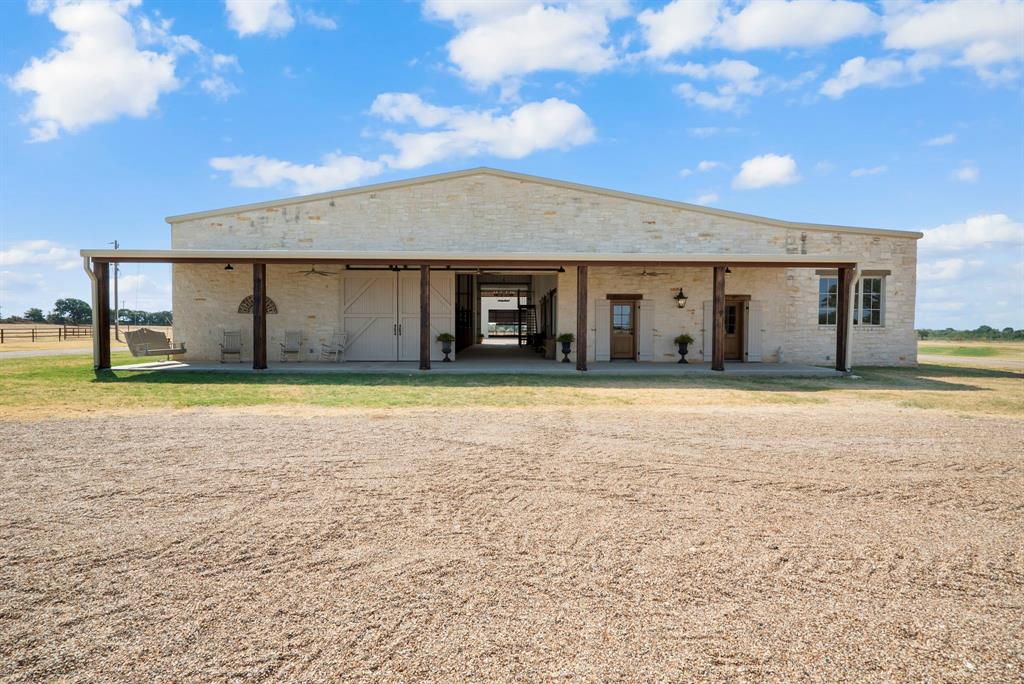 CALLING ALL COWBOYS!! CALLING ALL COWBOYS!! 28.5 ACRES IN STEPHENVILLE with ALL THE GOODS !! BEAUTIFUL TEXAS BARNDO with MASSIVE COVERED ARENA & IMMACULATE SHOW BARN !! Fenced & Cross fenced with LOAFING SHEDS and AUTOMATIC WATER. This RANCH was meticulously designed, FROM THE GROUND UP, with functionality and SAFETY IN MIND !! Whether you're a seasoned ROPER or just a passionate horse enthusiast, this ARENA sets the stage for refining your skills under the vast TEXAS sky!! If you thought the horses had it GOOD, then just step inside this STUNNING 2,835 SQ FT residence!! It's a place where MODERN COMFORT & COUNTRY CHARM seamlessly unite in this exceptional WESTERN setting!! This PROPERTY is loaded with CHARACTER featuring authentic brick floors, custom wood accents, and TOP OF THE LINE amenities. It's a fantastic blend of LUXURY AND COMFORT and really feels like HOME. AWESOME FRONT PORCH with SWING , BIG COVERED BACK PORCH, and SUPER NICE APARTMENT UPSTAIRS.  CASE TRACTOR & DRAG CONVEY