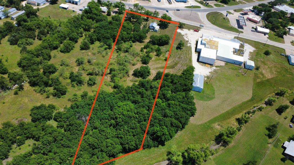 Positioned at a highly visible intersection with convenient highway frontage road access, this property offers exceptional accessibility and outstanding potential for a variety of uses. Come check out this beautiful tract of land offering the perfect blend of convenience and country charm. This property features a mix of open spaces and mature trees, creating endless possibilities for a future homesite, recreational retreat, or investment opportunity. With road frontage and easy access to town amenities, you can enjoy the peace and privacy of a rural setting while still being close to shopping, dining, and everyday conveniences. The natural landscape provides plenty of room to explore, build, or simply enjoy the scenic surroundings. Whether you are looking to develop, build your dream home, or own a piece of Texas land with great potential, this property is one you will not want to miss. Schedule your private showing today!