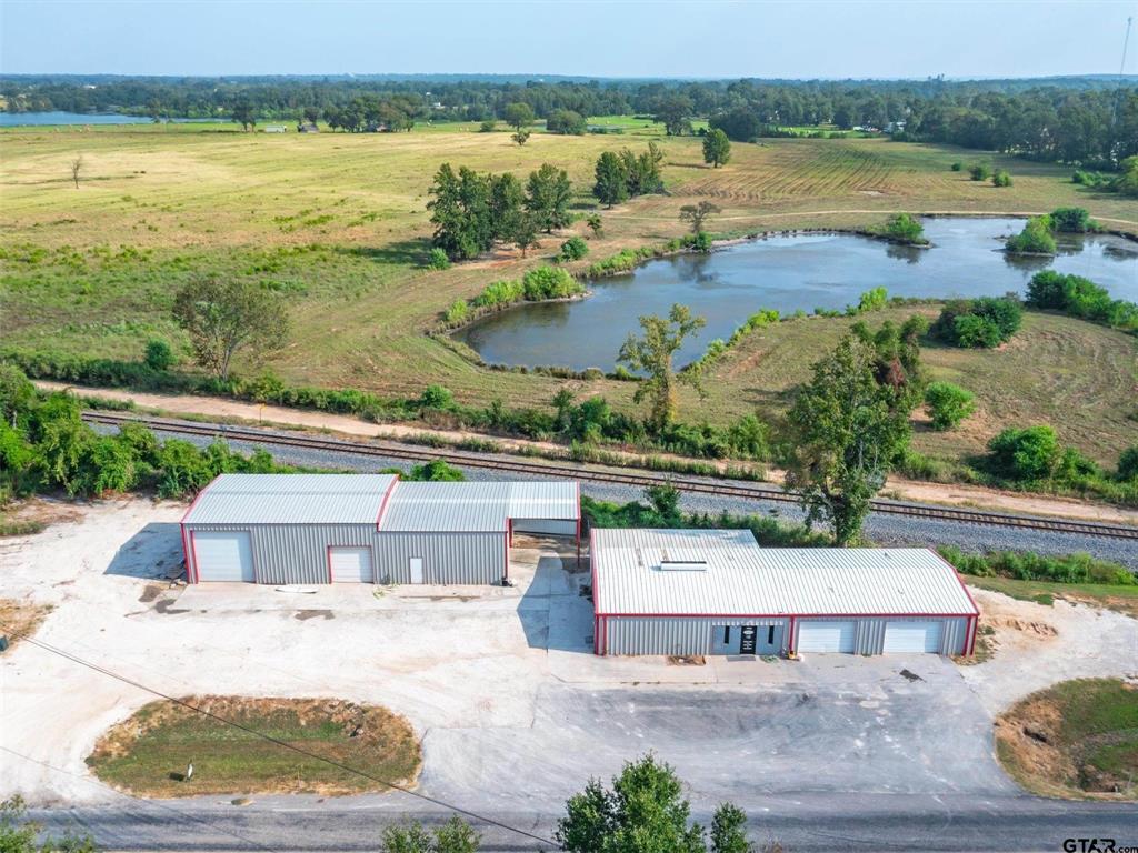 Commercial Property for Sale in Winnsboro, TX. This versatile commercial property offers an ideal combination of office and warehouse space, making it suitable for a wide range of business opportunities. With over 500 feet of road frontage, the property provides excellent visibility and convenient access just minutes from Winnsboro amenities, approximately 100 miles east of Dallas, and within 50 miles of Tyler and Longview. The office area features three private offices along with a reception area designed for a smooth and welcoming workflow. Warehouse 1 offers more than 2,900 square feet with two 10-foot roll-up dock doors. Warehouse 2 includes approximately 2,400 square feet and features one 16-foot, one 12-foot, and one 10-foot roll-up door. The layout and functionality of the property allow for flexible multi-purpose use across a variety of industries. This clean, move-in ready property offers excellent functionality, accessibility, and room for growth. The previous business expanded and relocated to a larger space, showcasing the success and potential this property can offer. Schedule your showing today to explore all the possibilities this commercial property has to offer.