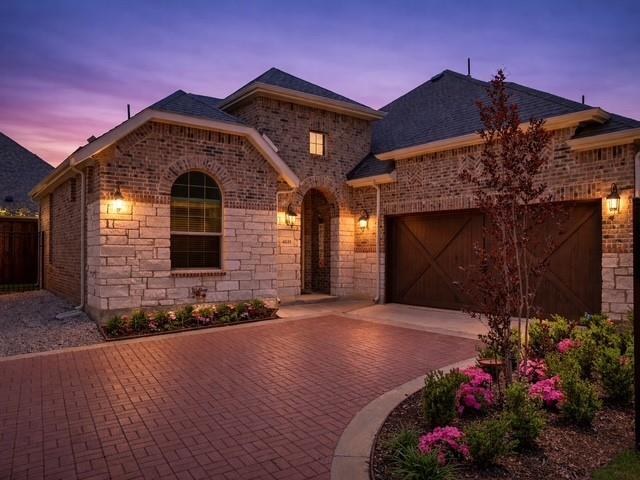 PRICE IMPROVEMENT! Discover resort-style 55+ living at The Elements at Viridian, where lakeside trails, pickleball, bocce ball, sailing, pools, and vibrant social events make every day feel like a getaway. Enjoy low-maintenance, lock-and-leave living just minutes from Dallas Fort Worth International Airport for effortless travel and connection.This like-new,1 year old home offers a rare 3-bedroom, 2-bath floor plan—hard to find in this community where most homes of this size feature only two bedrooms. Ideal for guests, hobbies, or a home office, this added space makes all the difference. Step inside to an inviting open-concept layout filled with natural light. The living, dining, and kitchen areas flow seamlessly together and are anchored by a beautiful fireplace that creates a warm, welcoming focal point from the moment you enter. Large windows and a thoughtfully designed layout make this home feel bright, spacious, and comfortable. This home is also pre-owned certified, meaning it has undergone a thorough inspection, all necessary repairs have been completed, and it is truly move-in ready. The owners have taken exceptional care to present a beautifully maintained home you can enjoy with confidence from day one. Enjoy beautiful curb appeal with welcoming landscaping—plus the convenience of HOA-maintained front yards. You can personalize with flowers while the HOA handles the rest, making for easy, low-maintenance living. Located within walking distance to the award-winning Magnolia Center, residents enjoy resort-style amenities including pickleball, bocce ball, putting green, pool, dog park, and miles of scenic walking trails—truly lakeside living at its best in this Audubon-certified community. With its rare layout, modern design, and unbeatable location within Viridian – Elements, this home is perfect for those looking to downsize without sacrificing space or style. Low-maintenance, move-in ready, and ideally located—this one is a must-see.