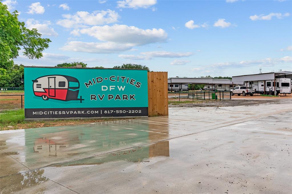 DFW Mid-Cities RV Park, located in Fort Worth, Texas, is a long-term RV park designed primarily to foster a sense of community. By seeking out residents who desire a stable, communal environment, DFW Mid-Cities RV Park provides a refreshing alternative to transient parks or typical apartment complexes. The park encourages a neighborhood atmosphere in which residents create genuine connection with one another.
Key features of the park include: Spacious, covered RV lots, complete with fiber internet hardwired to each pedestal; A large clubhouse complete with a game room, work-out room, 18-foot shuffleboard table, and an open kitchen with eating area for social gatherings; Two half-acre dog parks, one fully fenced, 7 Roomy bathrooms with walk-in showers, A laundry room with card-operated combination washer dryers, And a fully-equipped outdoor kitchen.

Location: Fort Worth,TX (conveniently located between Dallas and Fort Worth)
Acreage: 9.92 acres
RV Sites: 103 RV Sites equipped with full hook-ups (water, sewer, hardwired fiber internet, and individually metered electricity)
Year Built: Park was competed and opened in February 2024
Additional Buildings: Clubhouse - includes 7 exterior entry full bathrooms, laundry room with 6 washer-dryers, game-room with kitchen and dining area, work out room, 3 management offices, and a full outdoor kitchen.
Additional home on property recently updated featuring 2000 square ft, 4 bedrooms, 2 and a half bathrooms
Access: Near I-20 and South Arlington