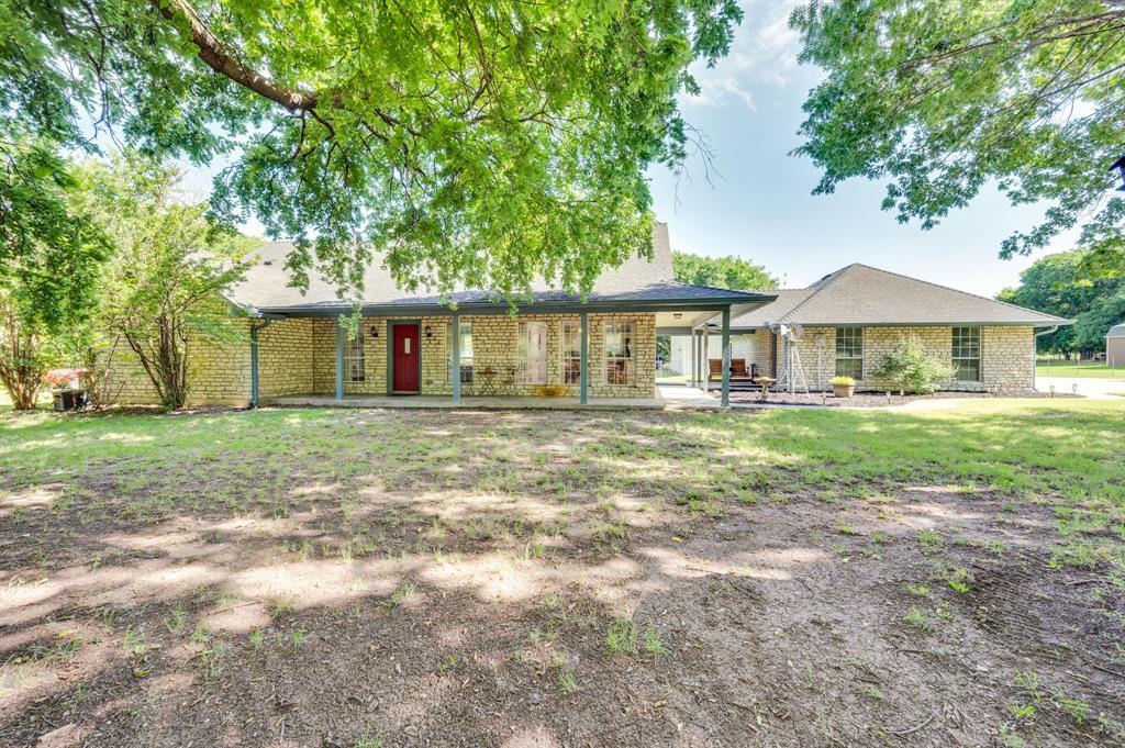 Escape to your own private slice of Texas on approximately 10.2 beautiful acres, where mature trees, open pasture, and endless possibilities create the perfect country lifestyle. This charming farmhouse-style home offers comfortable living while the land and improvements truly set this property apart.

Tucked away among towering shade trees, the home features spacious living areas, abundant natural light, and picturesque views of the surrounding property. The inviting farmhouse character creates a warm and welcoming atmosphere that instantly feels like home.

For those needing space to work, play, or pursue their passions, the impressive shop is a standout feature. Complete with an office, full bathroom, large overhead doors, and extensive workspace, it's ideal for a home-based business, equipment storage, hobbies, or recreational vehicles.

Horse enthusiasts will appreciate the well-designed barn with three stalls and fenced areas, providing plenty of room for horses, livestock, and outdoor enjoyment. The acreage offers a rare combination of privacy, usability, and natural beauty, with room to ride, roam, garden, or simply enjoy the peaceful surroundings.

Whether you're searching for a horse property, hobby farm, business setup, or a private retreat away from the hustle and bustle, this unique property offers the flexibility and freedom that are increasingly difficult to find. Conveniently located while still providing the tranquility of country living, this is an exceptional opportunity to own a versatile acreage property with all the essentials already in place.

Bring your horses, your business, your toys, and your dreams. This is Texas living at its best.

Livestock on property is available for purchase