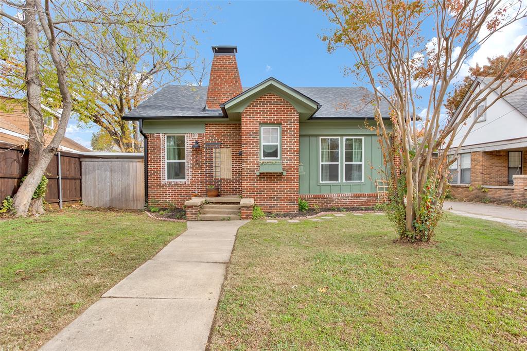 Cute as a button! In the heart of west Sherman's most desirable neighborhoods, this precious brick home has been beautifully refinished and converted into a 3 bed, 2 bath home - now ready for new owners! The open living area boasts tons of natural light, additional recessed lighting, original brick fireplace and original shiplap. Spacious dining and kitchen area with updated cabinets, countertops, stainless steel appliances, and plenty of storage. Primary bedroom includes ensuite bath with beautiful tile work and large walk-in shower. Front bedroom off the living room could easily be used as an office or play room. Step out the back door to sit and relax on the open wooden deck overlooking the large backyard! Wooden privacy fence makes it easy for pets to run and play. This is your opportunity to own a one-of-a-kind home on Woods Street, located just blocks away from Fairview Park! Don't miss out - call your favorite local Realtor and schedule your showing today!